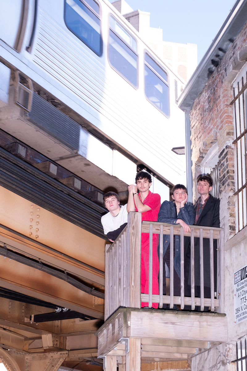 Photo of the band on a balcony